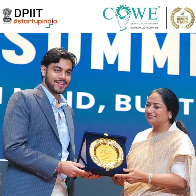A founder receives a memento at Youngpreneur Summit 2025